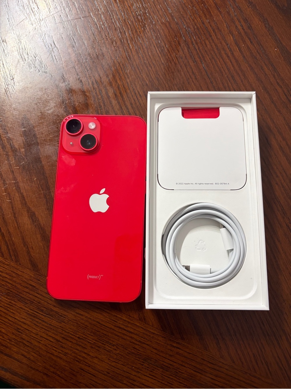 Apple iPhone 14 Red with White Charging Cable and Otterbox